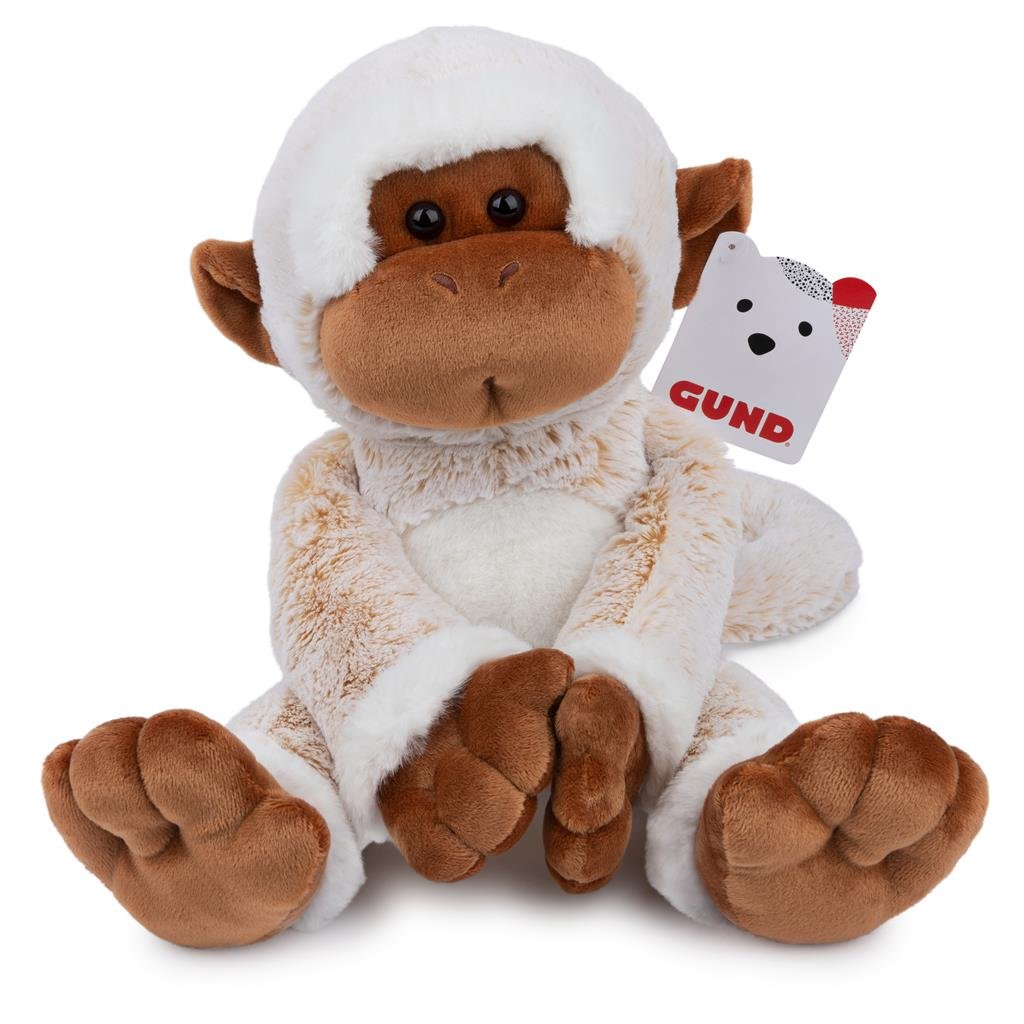 Plush monkey toy with snow on its head, featuring a GUND tag.