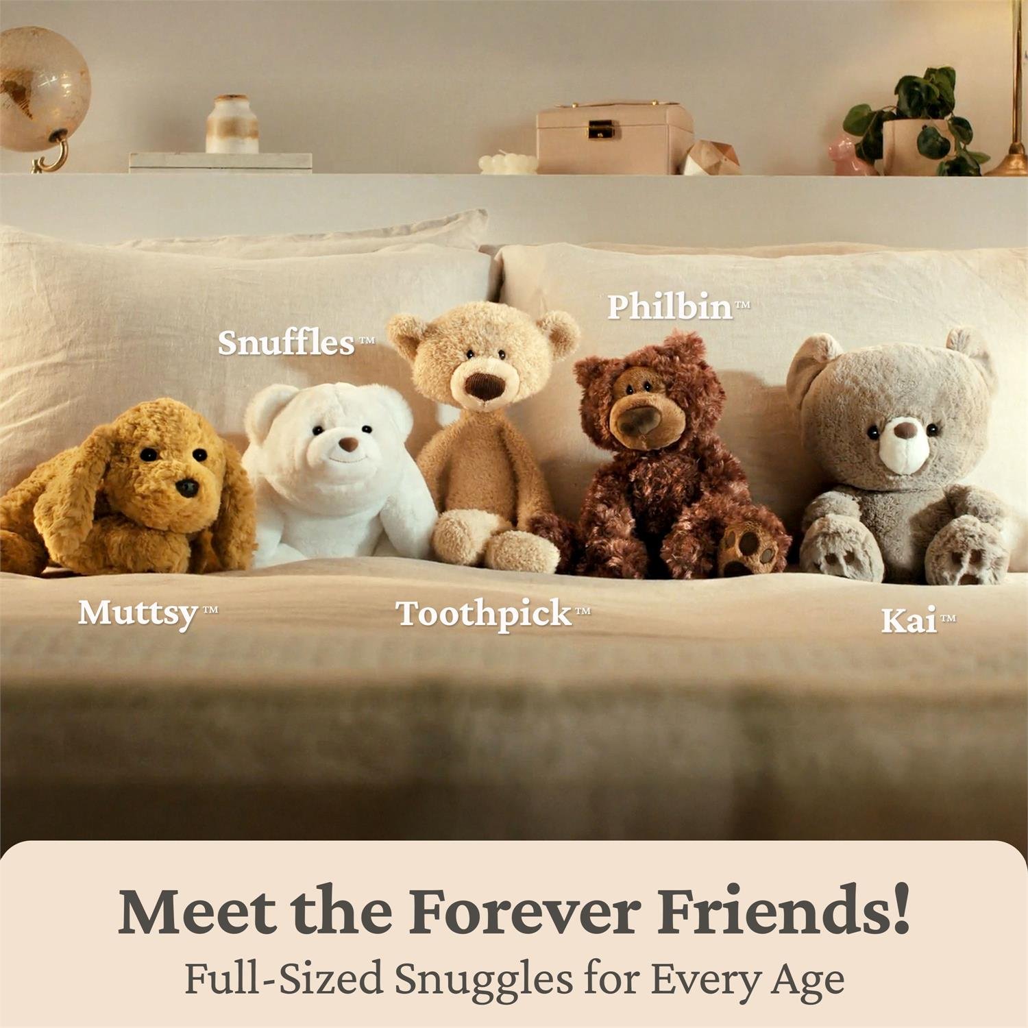 Five plush teddy bears arranged on a bed with pillows and a headboard in a styled bedroom setting. The bears are labeled with names: Muttsy, Toothpick, Snuffles, Philbin, and Kai.