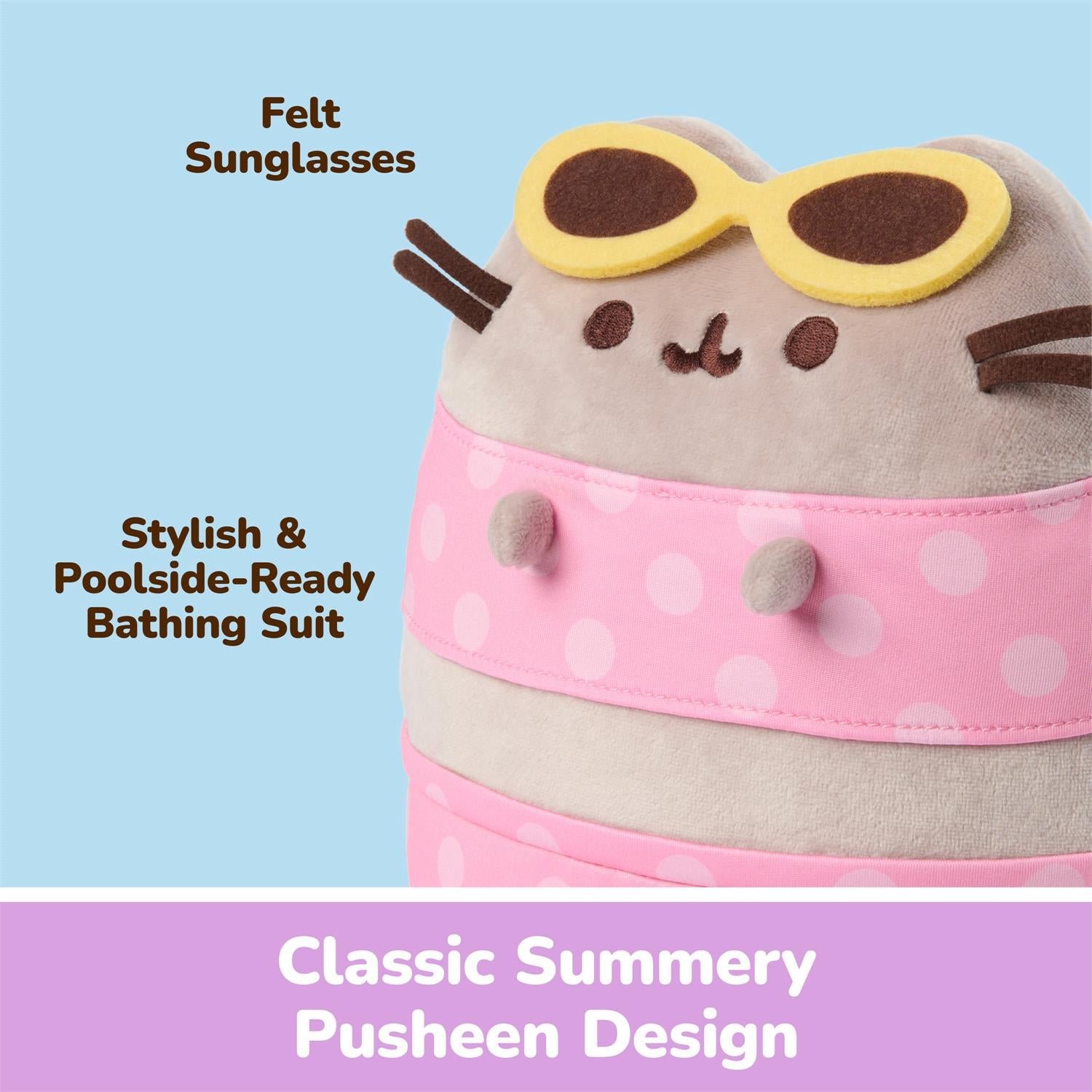 A plush bath toy styled like Pusheen wearing yellow felt sunglasses and a pink polka-dot swimsuit, with text labels reading 'Felt Sunglasses' and 'Stylish & Poolside-Ready Bathing Suit' on a light blue background.