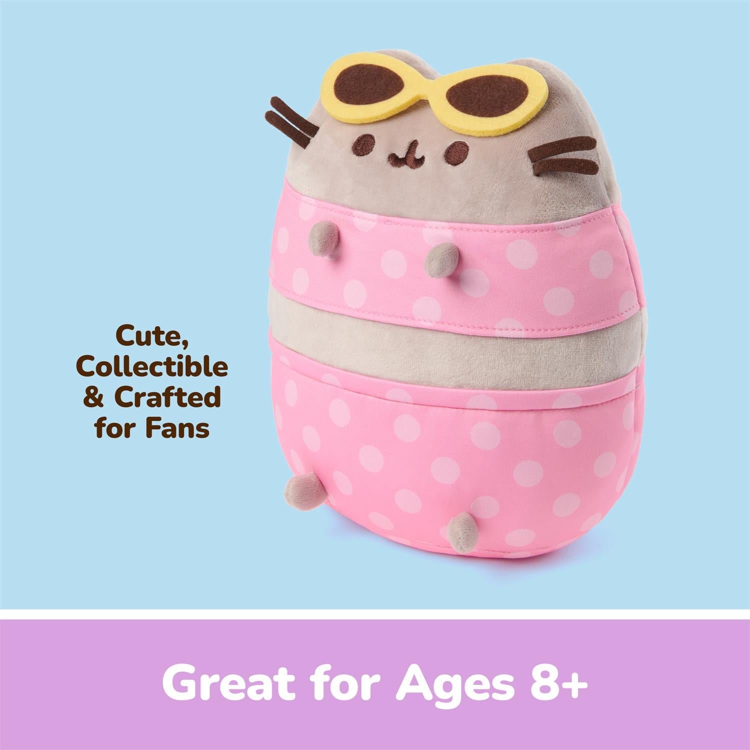 A plush collectible character toy shaped like a round cat-like figure wearing yellow sunglasses, with a gray top half and pink polka-dot bottom half, shown on a light blue background with promotional text and a purple banner reading 'Great for Ages 8+'.