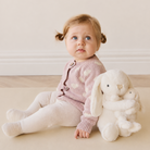 Cream plush hugging bunny set with mama and baby by Snuggle Bunnies, soft textured fur, side view with child in pink heart sweater.