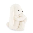 White plush toy sitting on a white background